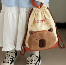 Cargar imagen en el visor de la galería, Mochila de dibujos animados capybara para niña, bolsa con cordón de Anime, gran capacidad, lona resistente MOD M02083
