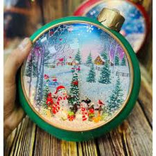 Cargar imagen en el visor de la galería, Adorno navideño musical, con caída de nieve, dos diseños colores MOD WDL-24075A B
