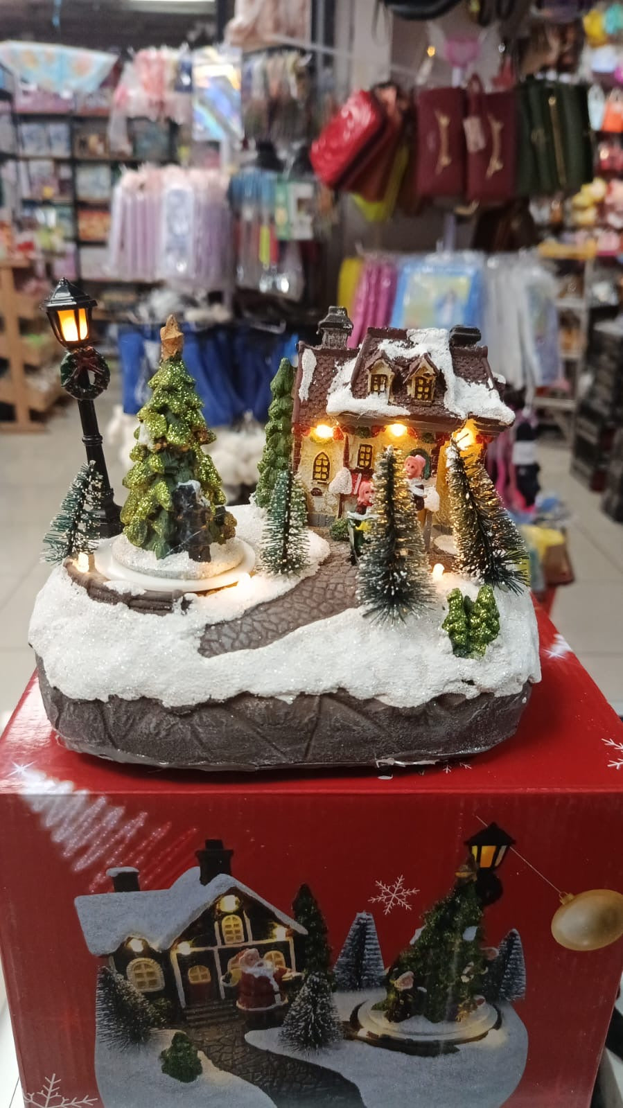 Villa navideña musical, con luces y ocho sonidos diferentes modelo MOD S114