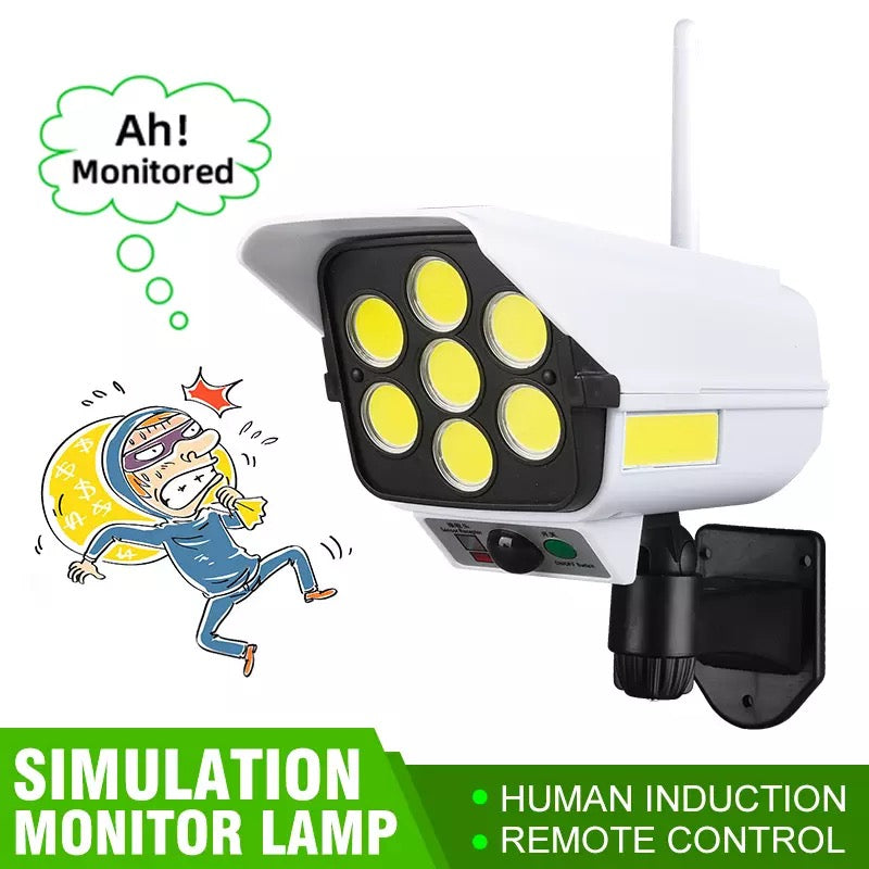Lámpara Solar con detección de movimiento 77LED, iluminación de cámara simulada de seguridad de calle al aire libre con Control remoto IP65, foco de 3 modos para jardín.  YH-2178T