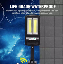 Cargar imagen en el visor de la galería, Luz Solar 128 COB para exteriores, farola impermeable con Sensor infrarrojo, Sensor de movimiento, luz con Control remoto inteligente.  W755-3
